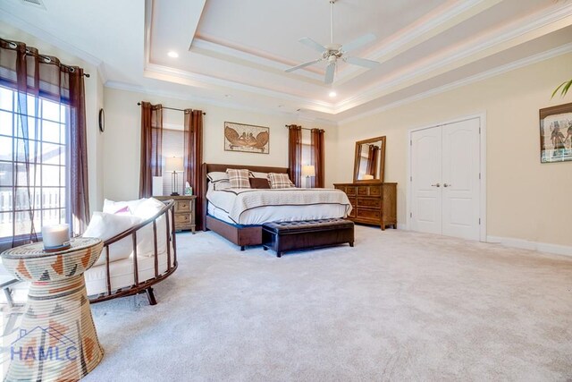 86 Brigham Dr, Richmond Hill, GA 31324 - bedroom featuring multiple windows, light colored carpet, ornamental molding, and a tray ceiling