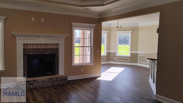 unfurnished living room with dark wood finished floors, a brick fireplace, and crown molding