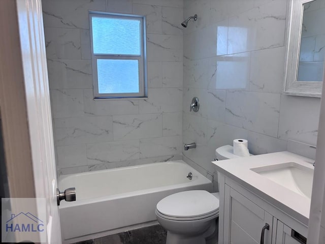 bathroom featuring toilet, tile walls, bathtub / shower combination, and vanity