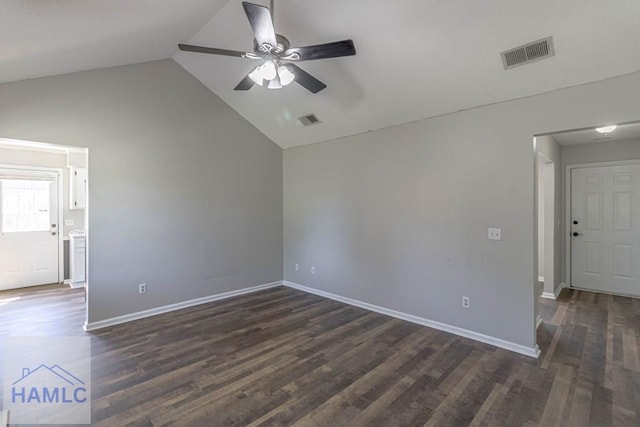 spare room featuring visible vents, dark wood finished floors, and a ceiling fan