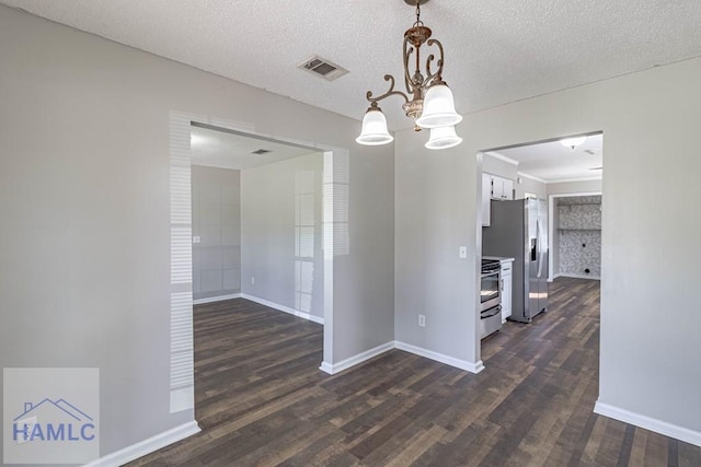 unfurnished dining area featuring visible vents, baseboards, dark wood-style floors, and a chandelier