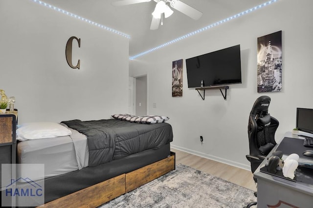 bedroom featuring ceiling fan and light hardwood / wood-style flooring