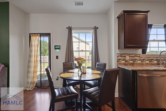 189 Morningside Dr, Allenhurst, GA 31313 - dining space with plenty of natural light, dark wood-style flooring, and baseboards