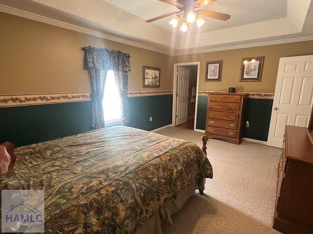 189 Sooner Dr, Jesup, GA 31545 - bedroom featuring light carpet, crown molding, a tray ceiling, and ceiling fan
