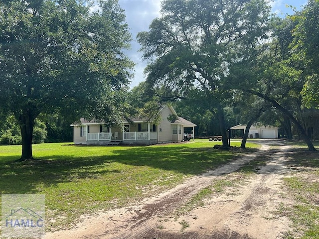 189 Sooner Dr, Jesup, GA 31545 - view of front of property with a porch, a garage, a front lawn, and dirt driveway