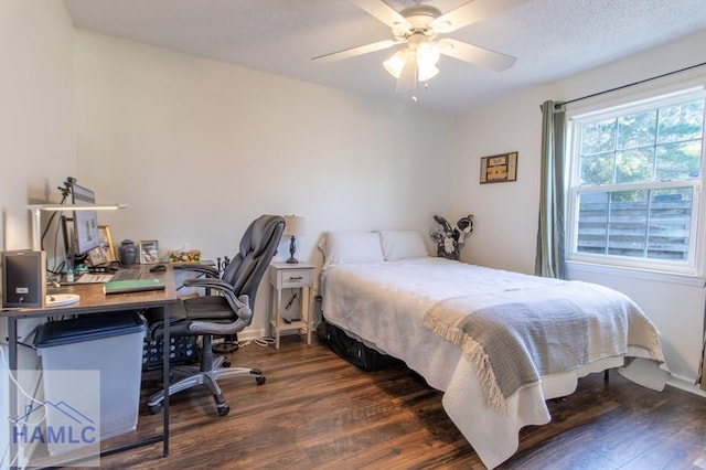 bedroom with baseboards and dark wood-style flooring