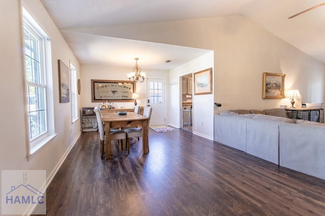 dining room with a chandelier, dark wood-type flooring, visible vents, baseboards, and vaulted ceiling