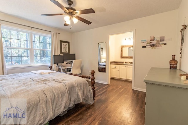 bedroom with a ceiling fan, connected bathroom, baseboards, and dark wood-type flooring