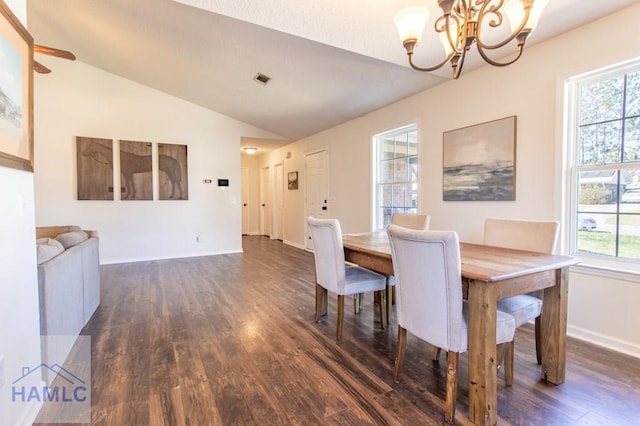 dining area featuring lofted ceiling, dark wood-style floors, baseboards, and a notable chandelier