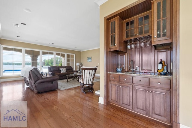 745 Chickasaw Trl, Sparta, GA 31087 - indoor wet bar with ornamental molding, wood finished floors, baseboards, and recessed lighting