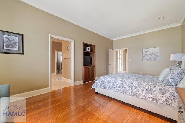 745 Chickasaw Trl, Sparta, GA 31087 - bedroom featuring ornamental molding, light wood-style floors, and baseboards