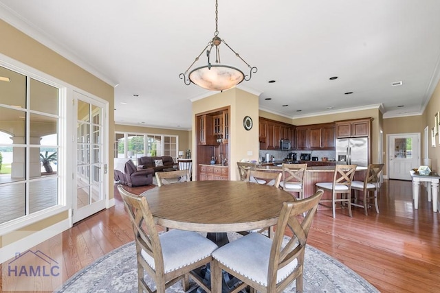 745 Chickasaw Trl, Sparta, GA 31087 - dining area featuring light wood-style floors, crown molding, and recessed lighting