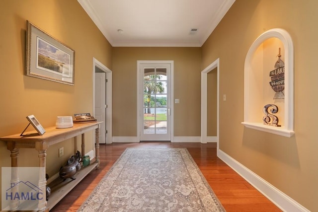 745 Chickasaw Trl, Sparta, GA 31087 - doorway to outside featuring wood finished floors, ornamental molding, and baseboards