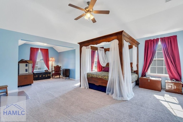 bedroom with carpet floors, baseboards, a ceiling fan, and lofted ceiling