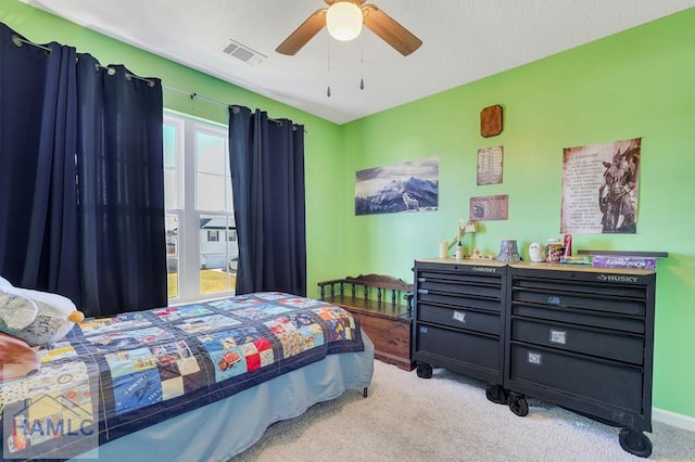 bedroom featuring carpet flooring, a ceiling fan, baseboards, and visible vents