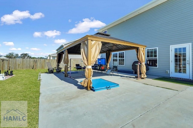 view of patio / terrace with a gazebo and a fenced backyard