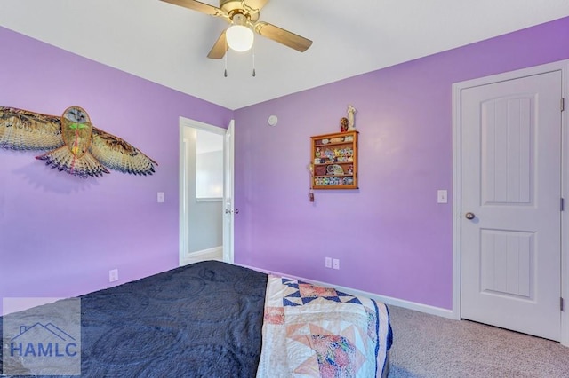 bedroom with baseboards, carpet, and a ceiling fan