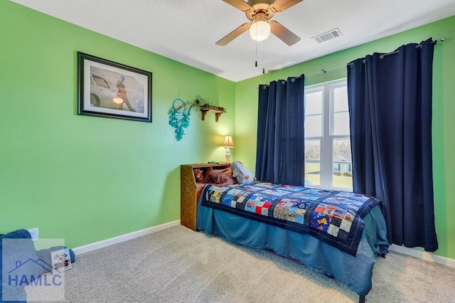 bedroom featuring carpet flooring, baseboards, visible vents, and ceiling fan
