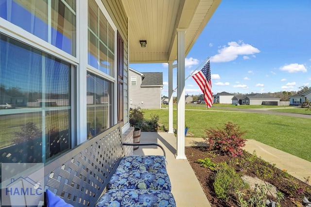 view of patio featuring a porch and a residential view