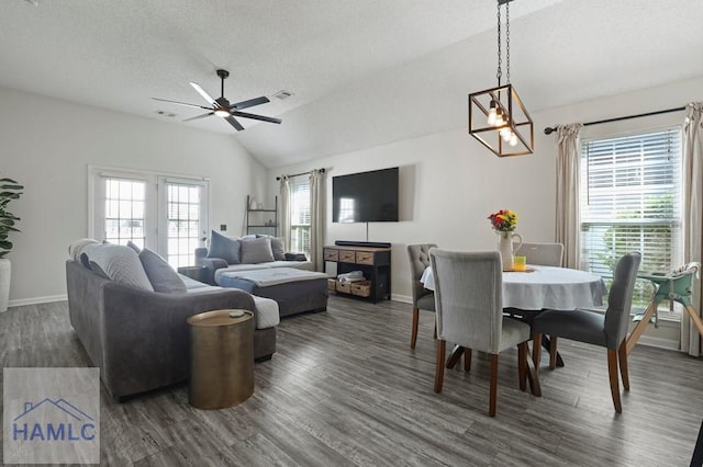 99 Scarlett Ln, Richmond Hill, GA 31324 - dining area featuring vaulted ceiling, dark wood-style floors, a ceiling fan, a chandelier, and a textured ceiling