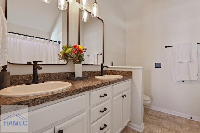 99 Scarlett Ln, Richmond Hill, GA 31324 - bathroom featuring double vanity and toilet
