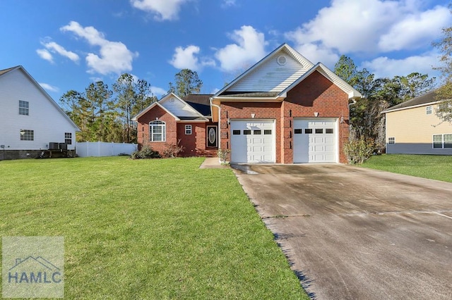 view of front of house with fence, driveway, a front lawn, a garage, and brick siding