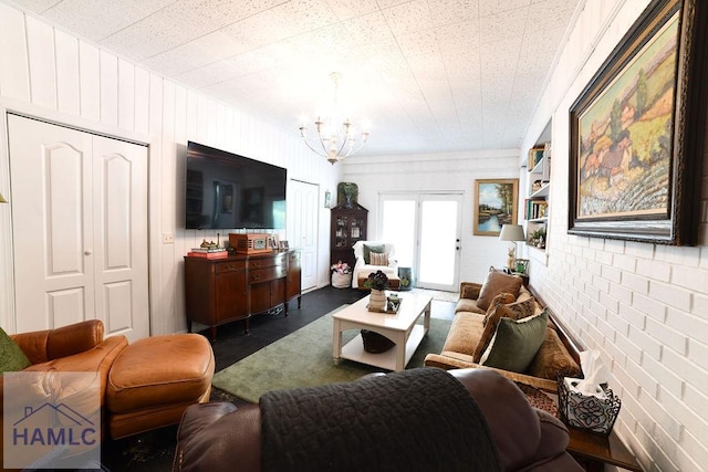 705 S Elm St, Jesup, GA 31545 - living room featuring a chandelier and brick wall