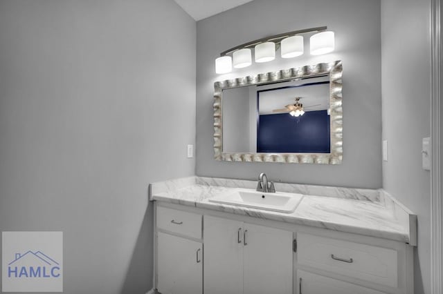 bathroom with ceiling fan and vanity