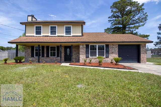 view of front of property with brick siding, fence, a garage, a front yard, and concrete driveway