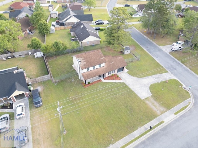 birds eye view of property with a residential view