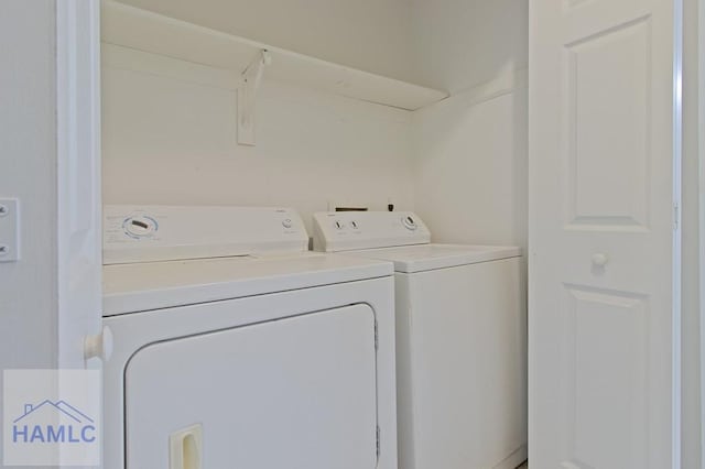 laundry room with independent washer and dryer and laundry area