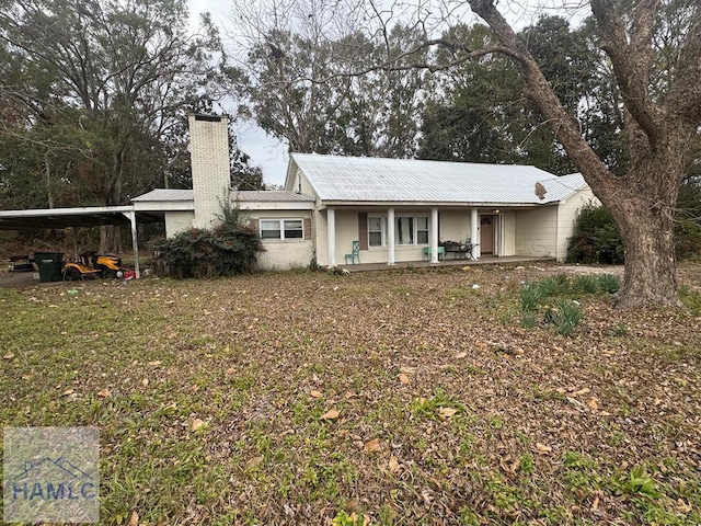 ranch-style house with a carport