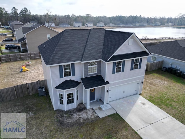 view of property with a garage, central air condition unit, and a water view