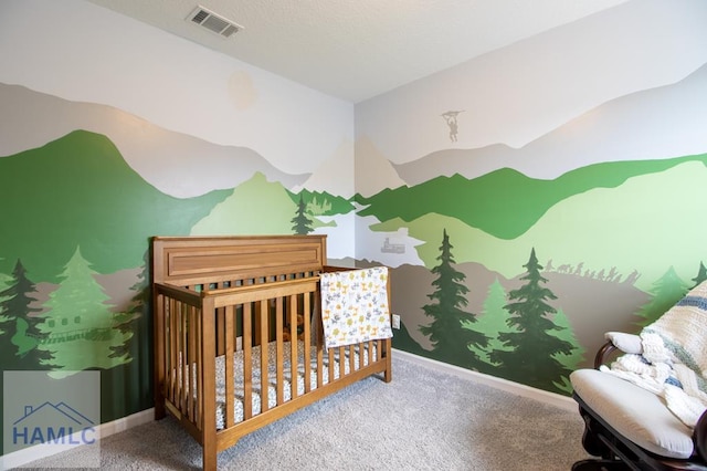 carpeted bedroom featuring a nursery area, baseboards, and visible vents