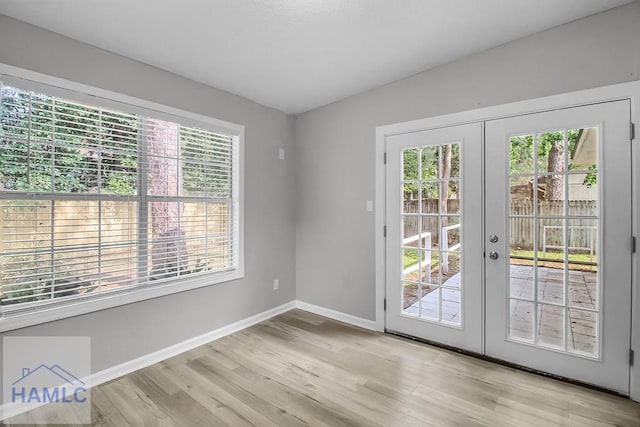 905 Greenbriar Rd, Hinesville, GA 31313 - doorway featuring wood finished floors, french doors, and baseboards