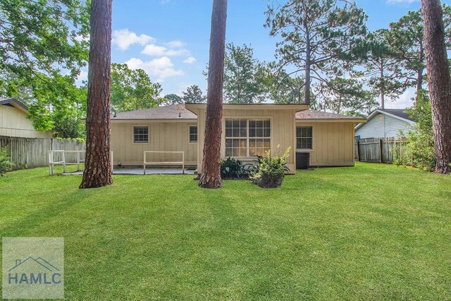 905 Greenbriar Rd, Hinesville, GA 31313 - back of house featuring central AC and a patio