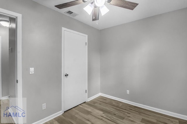 905 Greenbriar Rd, Hinesville, GA 31313 - unfurnished bedroom with wood finished floors, baseboards, and a ceiling fan