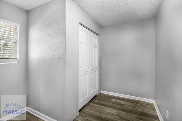 905 Greenbriar Rd, Hinesville, GA 31313 - hallway with wood finished floors, baseboards, and a textured ceiling