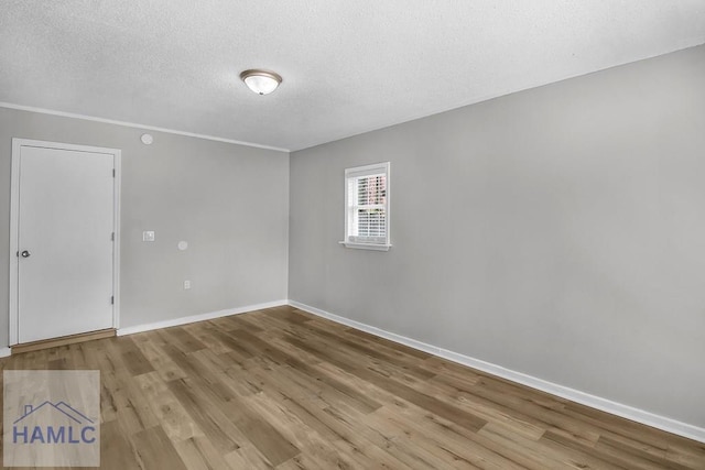 905 Greenbriar Rd, Hinesville, GA 31313 - unfurnished room featuring a textured ceiling, wood finished floors, and baseboards