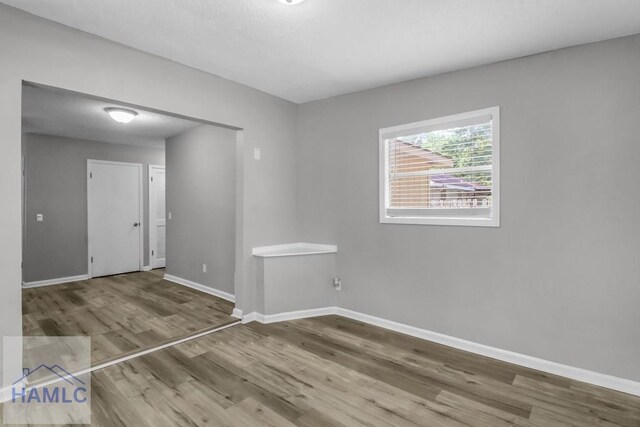 905 Greenbriar Rd, Hinesville, GA 31313 - spare room with wood finished floors and baseboards