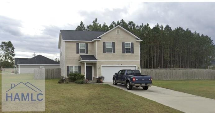 traditional-style house with fence, an attached garage, concrete driveway, and a front yard