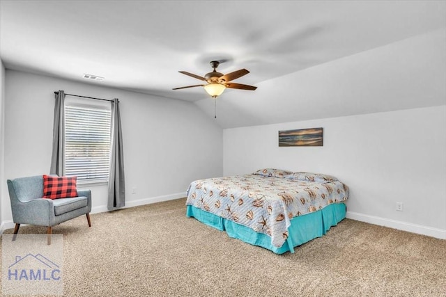 bedroom featuring carpet flooring, baseboards, and vaulted ceiling