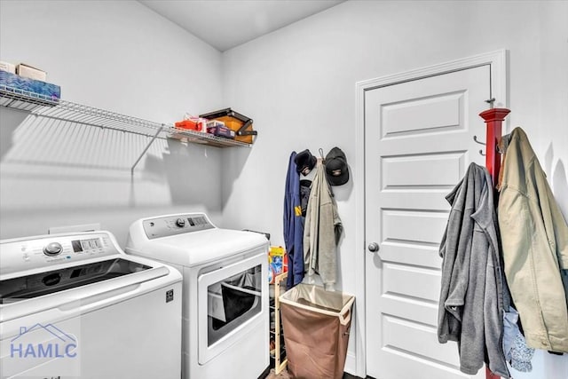 laundry room featuring washing machine and dryer and laundry area