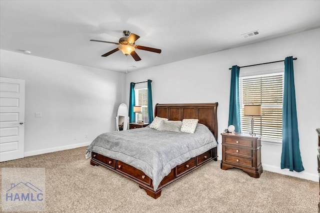 bedroom with carpet flooring, baseboards, ceiling fan, and visible vents