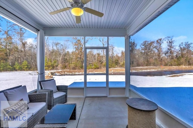 sunroom / solarium featuring an outdoor hangout area, a ceiling fan, and plenty of natural light
