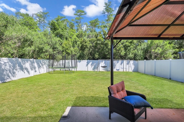 view of yard with a trampoline