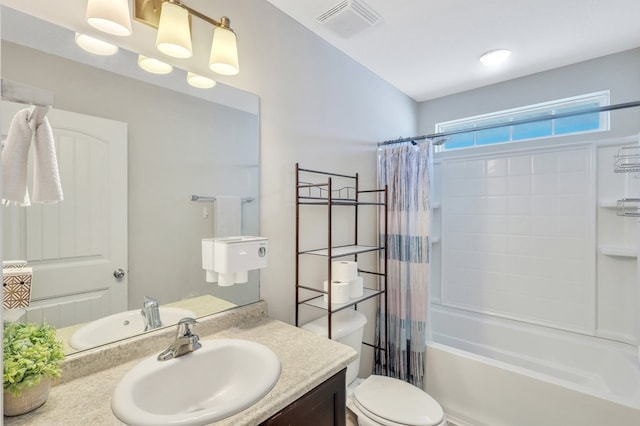 full bathroom featuring toilet, vanity, and shower / tub combo with curtain