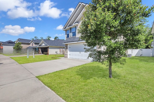 view of front of property featuring a front yard and a garage