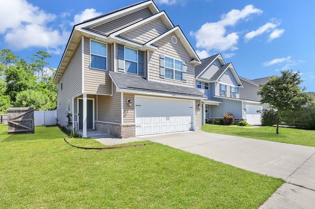 view of front of property featuring a garage and a front lawn