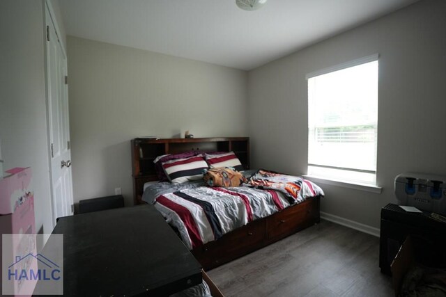 613 Macon St, Ludowici, GA 31316 - bedroom with wood finished floors and baseboards